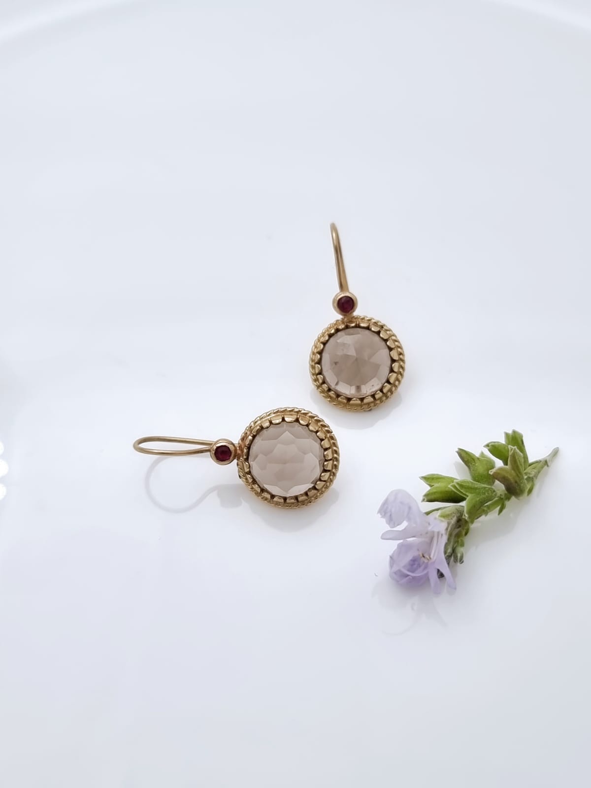 14K gold earrings set with smoky topaz and garnet