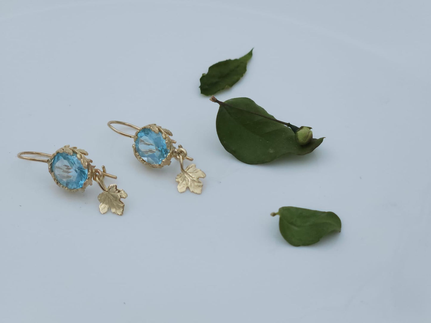 14K Gold Earrings Decorated with Leaves, Set with Blue Topaz