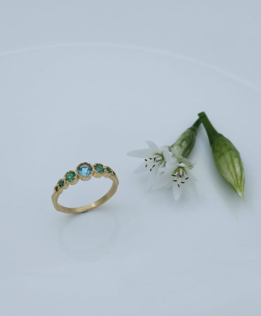 14K Gold Ring Set with Blue Topaz and Emeralds