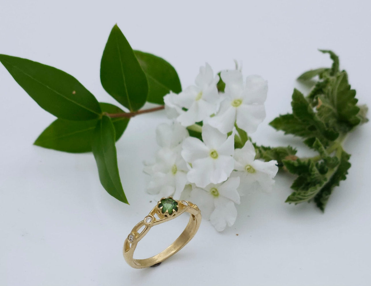 14K Gold Ring Set with Green Tourmaline and 0.06 ct White Diamonds