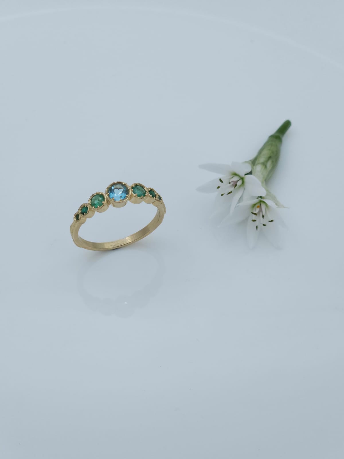 14K Gold Ring Set with Blue Topaz and Emeralds