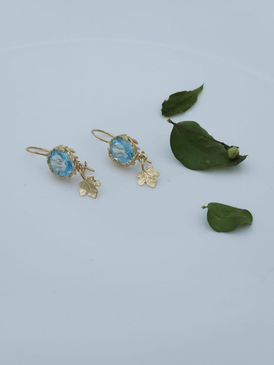 14K Gold Earrings Decorated with Leaves, Set with Blue Topaz