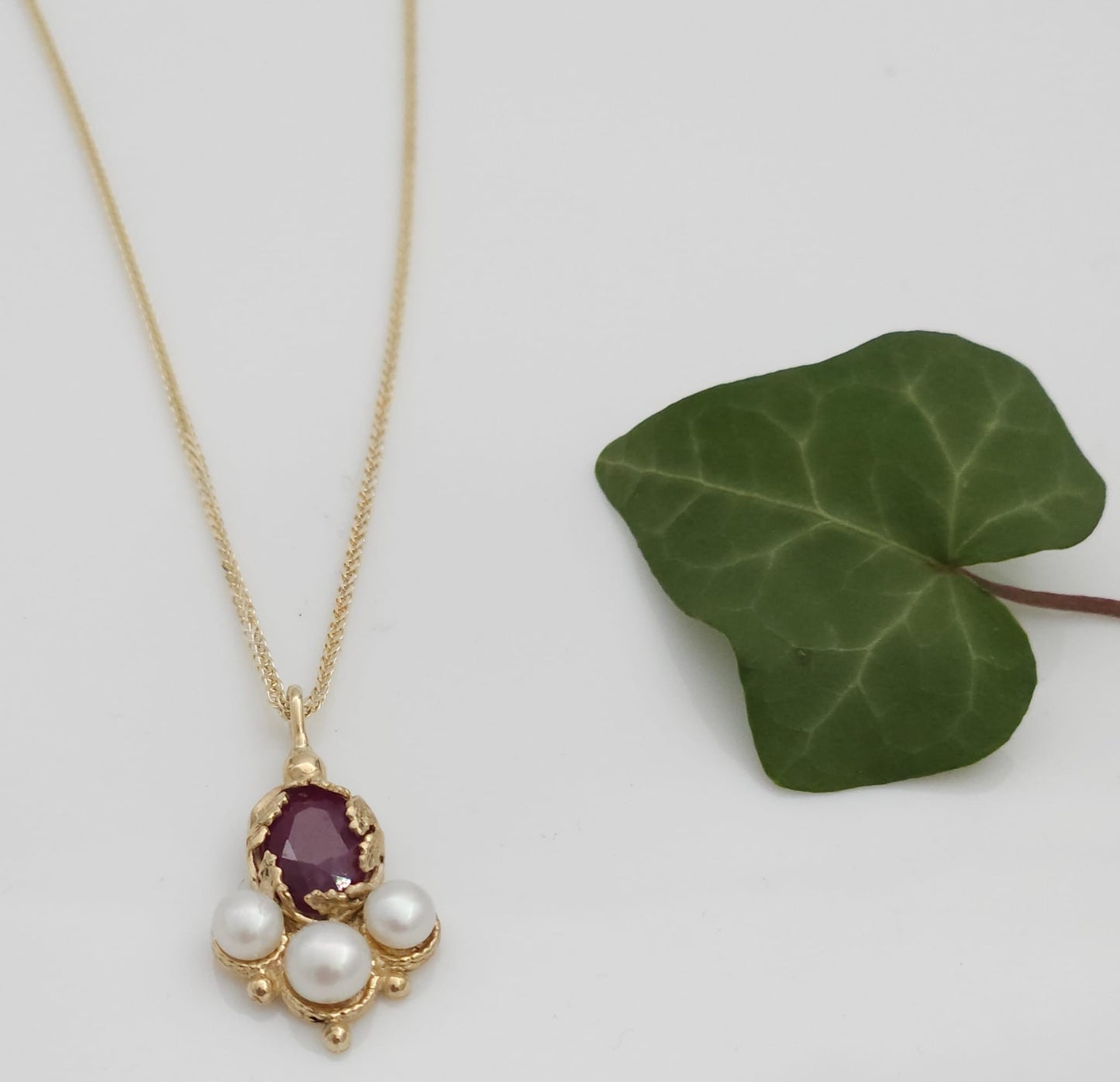 14K Gold Pendant and Necklace in an Antique Style, Adorned with Leaves, Set with a Natural Ruby and White Pearls