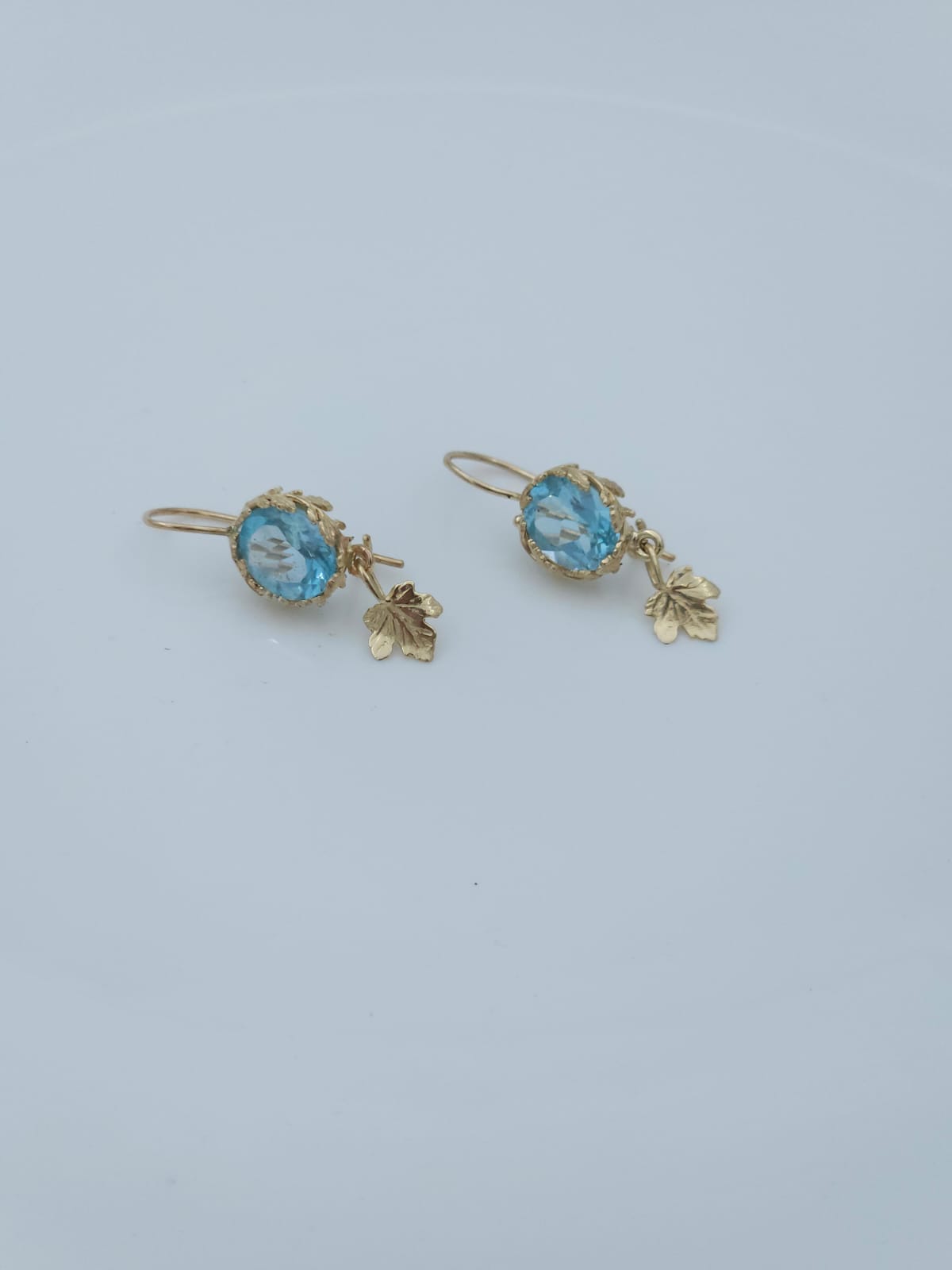 14K Gold Earrings Decorated with Leaves, Set with Blue Topaz