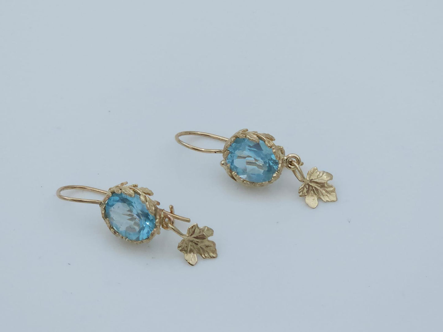 14K Gold Earrings Decorated with Leaves, Set with Blue Topaz