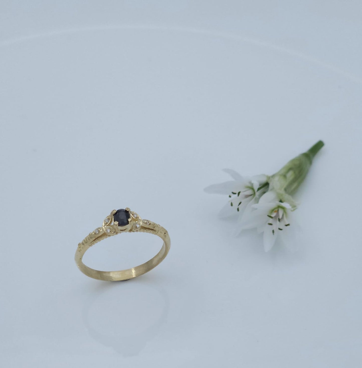 14K Gold Ring in Antique Style Set with Blue Sapphire and Side Diamonds