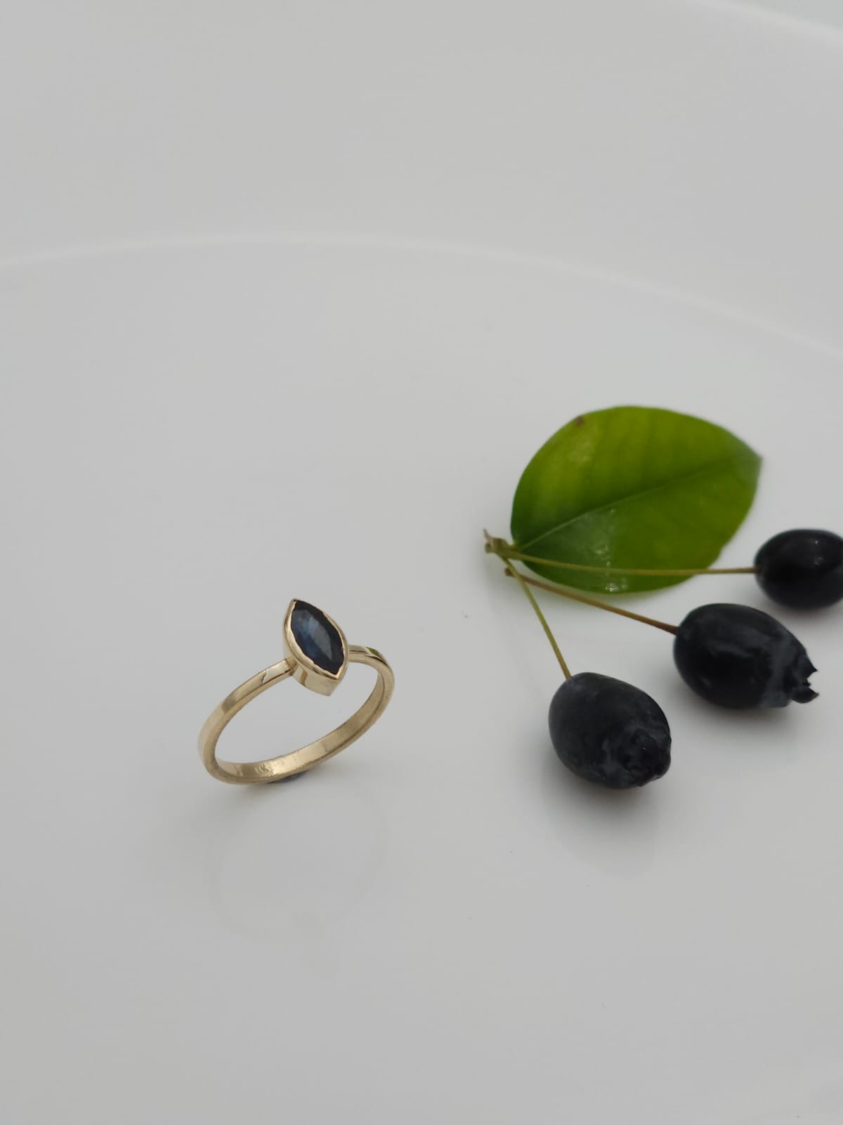 14K Gold Elegant Ring Set with a Marquise-Cut Sapphire