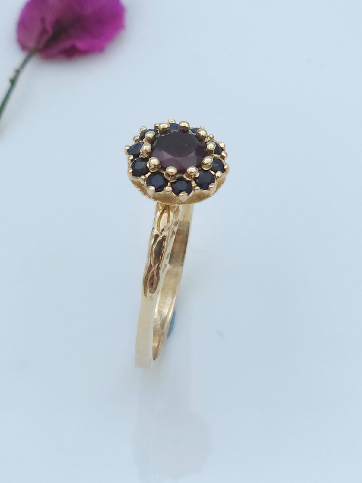 Antique style 14-karat gold ring set with garnet and sapphire stones