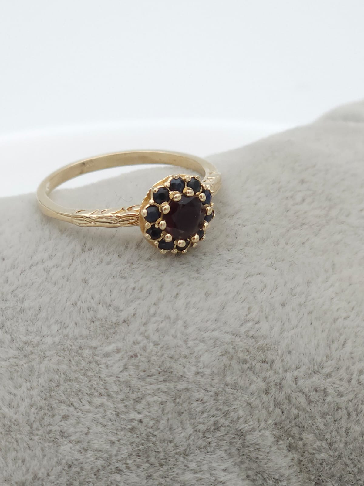 Antique style 14-karat gold ring set with garnet and sapphire stones